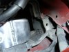 Hole drilled in power steering line bracket.JPG